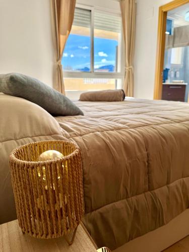 a bedroom with a large bed with a wicker basket at Relax time! in Casas Devesa