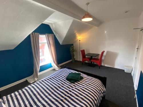 Ένα ή περισσότερα κρεβάτια σε δωμάτιο στο bnb