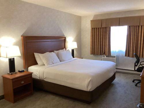 Ένα ή περισσότερα κρεβάτια σε δωμάτιο στο Best Western Glengarry