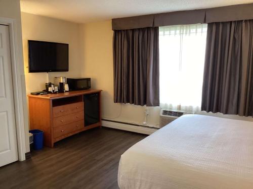 Ένα ή περισσότερα κρεβάτια σε δωμάτιο στο Best Western Glengarry
