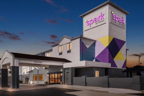a building with a sign on the side of it at Spark by Hilton Oxford in Oxford