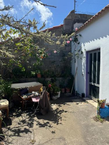 a patio in the back yard of a house at CommunityHostel CoCreation Project in Agulo