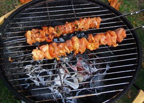 a bunch of food cooking on a grill at Katase Suvemaja in Katase
