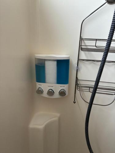 a coffee maker on a wall next to a water heater at Freeman Enterprises LLC in Las Vegas