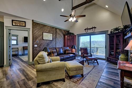 a living room with a couch and a chair at The Owlery Walk to Town in Highlands