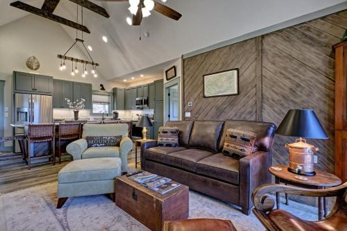 a living room with a couch and a table at The Owlery Walk to Town in Highlands