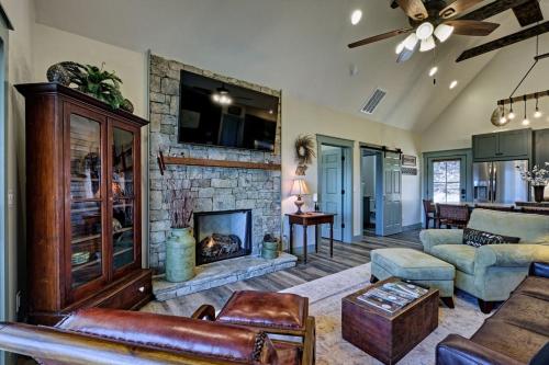 a living room with a fireplace and a couch at The Owlery Walk to Town in Highlands