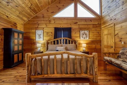 a bedroom with a bed in a log cabin at Grand Lodge in Sevierville