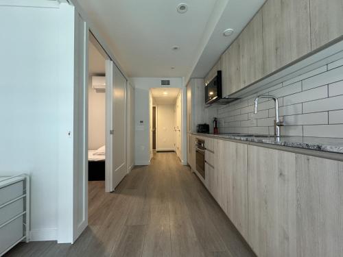 a kitchen with a sink and a counter top at Downtown Center Silverstone Tower I and II Long-Term Booking Only Your second home in Vancouver in Vancouver
