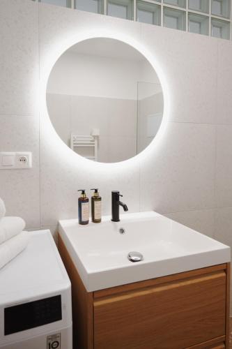 a bathroom with a sink and a mirror at Toffino in Trnava