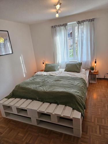 Postel nebo postele na pokoji v ubytování Tegerfelden Weinregion