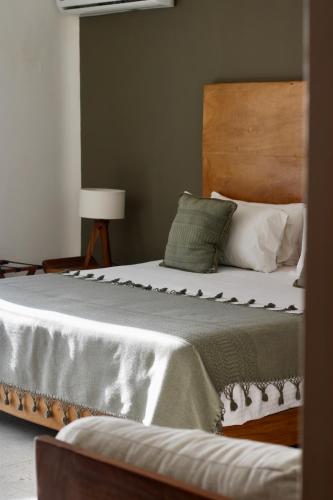 El Paraiso Hotel Tulumにあるベッド