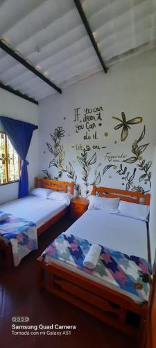 Postel nebo postele na pokoji v ubytování hostal posada san jose