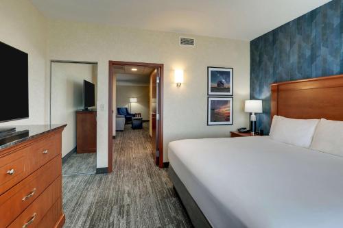 a hotel room with a bed and a flat screen tv at Drury Plaza Hotel Mt Vernon in Mount Vernon