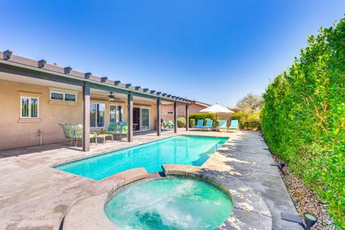 a swimming pool in the backyard of a house at Gateway Grand Oasis Palm Springs Gem with Pool! in Palm Springs