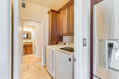 a laundry room with a washer and dryer at Gateway Grand Oasis Palm Springs Gem with Pool! in Palm Springs