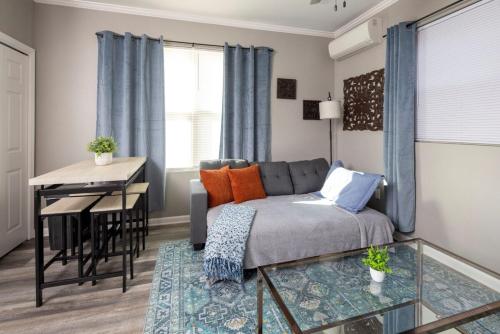 a living room with a couch and a table at Little Rock - Stylish Little Rock Downtown Escape in Little Rock