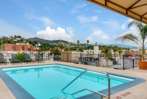 a swimming pool with a view of a city at Snazzy 2Bd Apartment Rooftop Pool & Iconic Hollywood Sign Views in Los Angeles