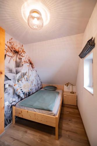 a small bedroom with a bed in a room at Holiday home in Trebnje - Kranjska (Krain) 53751 in Trebnje