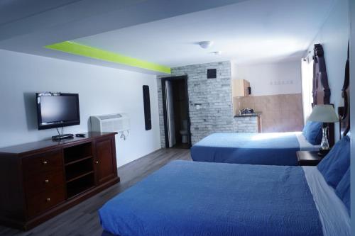 Ένα ή περισσότερα κρεβάτια σε δωμάτιο στο Crestwood Motel