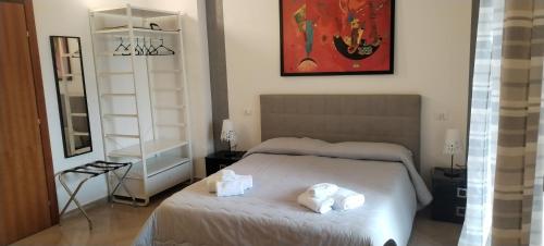 Postel nebo postele na pokoji v ubytování SUITE PRINCIPE SCORDIA