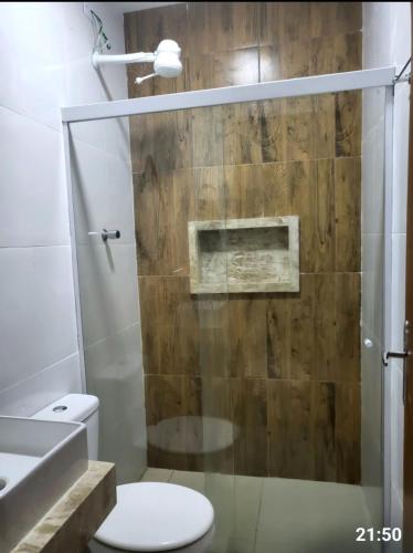a bathroom with a shower with a toilet and a sink at Dunas residence casa 15- Lençois Maranhense in Santo Amaro