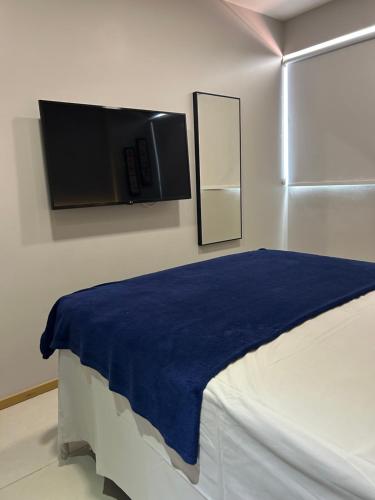 Ένα ή περισσότερα κρεβάτια σε δωμάτιο στο Apartamento aconchegante em Praia do Francês