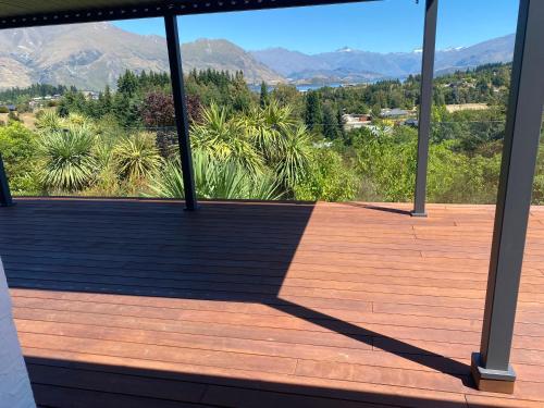 a balcony with a view of the mountains at Ridgehouse Wanaka in Wanaka