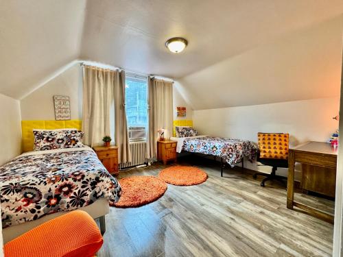 a bedroom with two beds and a desk at Private room with two twin beds air conditioning and shared bathrooms located near SeaTac Airport and Downtown Seattle in Seattle