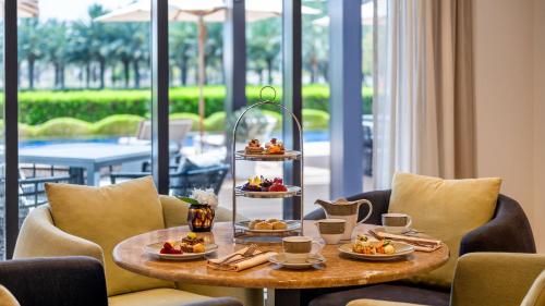 a table with a tray of food on top at InterContinental Fujairah Resort by IHG in Al Aqah
