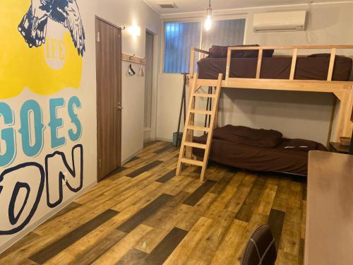Postel nebo postele na pokoji v ubytování Arcade Resort Okinawa