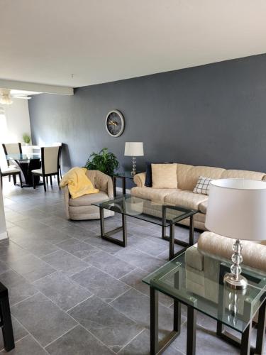 a living room with two couches and a table at Entire 2 level townhouse in Old Town Scottsdale! in Scottsdale