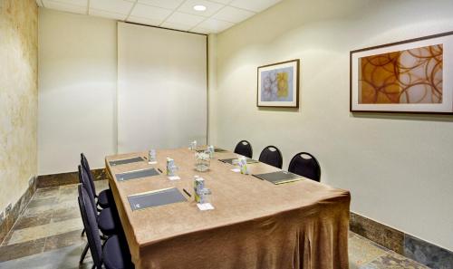 a conference room with a long table and chairs at Sercotel Puerta de la Catedral in Salamanca