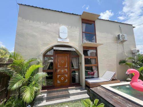 a house with a pink flamingo in front of it at The Phalosaa Villa in Ngaglik