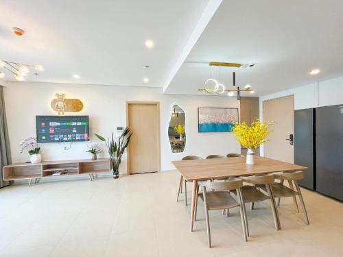 a dining room with a table and chairs at The Sóng Vũng Tàu Escape Apartment in Vung Tau