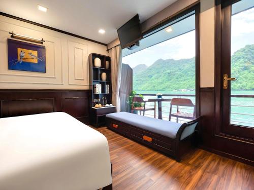 a bedroom with a bed and a large window at Amanda Luxury Cruise in Ha Long