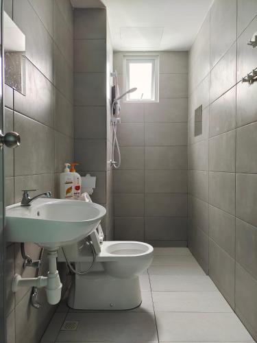 a bathroom with a sink and a toilet at Metropol Serviced Apartment - Bukit Mertajam, Penang in Bukit Mertajam