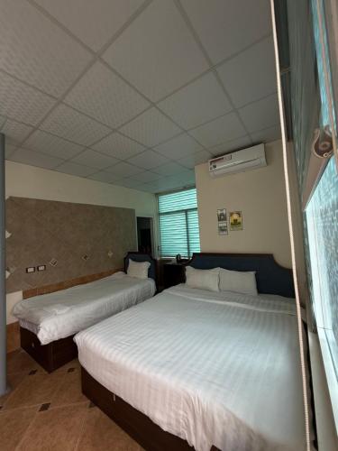 Postel nebo postele na pokoji v ubytování Hanoi Hidden Guest House