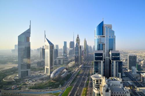 an aerial view of a city with tall buildings at voco Dubai by IHG in Dubai
