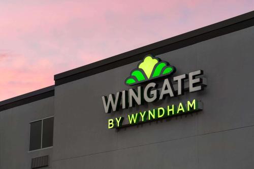 a sign on the side of a building at Wingate by Wyndham Fletcher at Asheville Airport in Fletcher