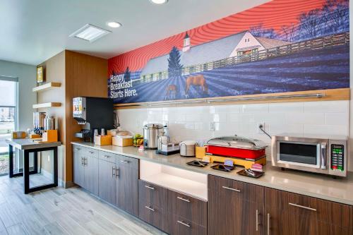 a kitchen with a counter top with a microwave at Hampton Inn & Suites By Hilton Louisville East Oxmoor in Louisville