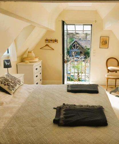 Ένα ή περισσότερα κρεβάτια σε δωμάτιο στο Maison d'hôtes La Danasha