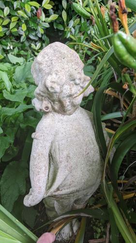 a statue of a frog sitting in the grass at Cherrywood-luxe retreat in the Southern Highlands in Exeter