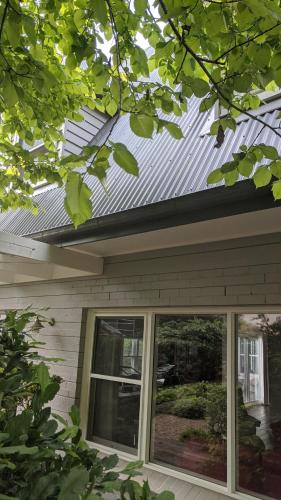 a metal roof on top of a house at Cherrywood-luxe retreat in the Southern Highlands in Exeter