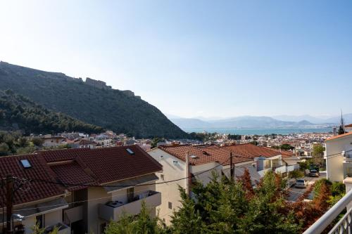 a view of a city with mountains in the background at Aerinon Guesthouse in Nafplio