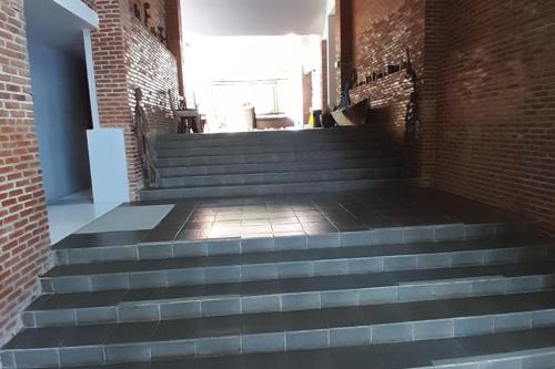 a set of stairs in a brick building at The Pulisan in Likupang
