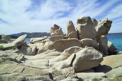 a pile of rocks on a beach near the water at Casa Marina Maria in Murta Maria