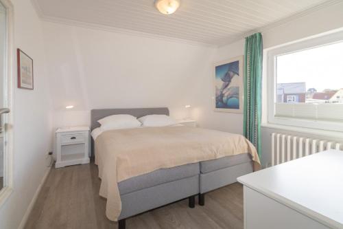 Postel nebo postele na pokoji v ubytování Haus Roseneck App.4