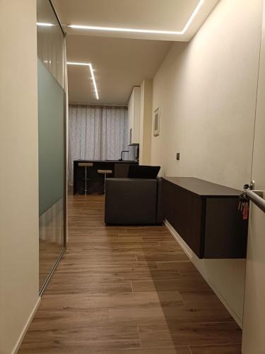 an office with desks and a table in a room at [Riviera Apartments] Near the beach + Parking in Rosolina Mare