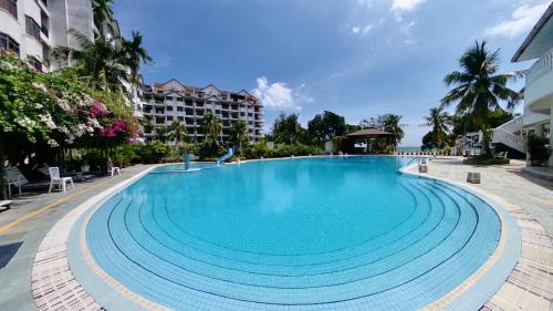 a large swimming pool in the middle of a building at 4-10 pax, Open concept BBQ at Private Seaview in Port Dickson